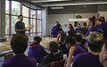 Class of youth learning at a Mini University session.