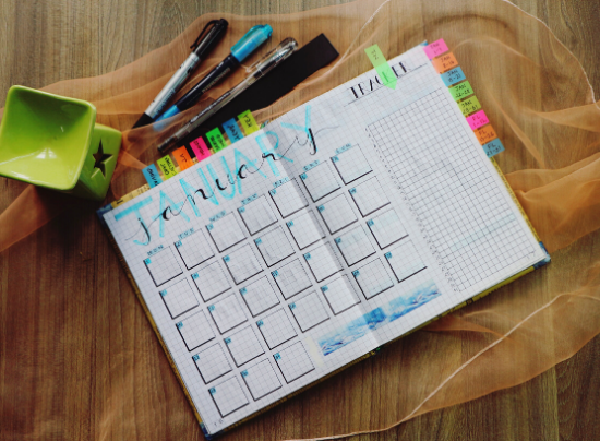 A view of a planner with markers.